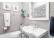 Bathroom featuring a modern sink, toilet, framed artwork, and shower at 25 E 40Th St # Apt 1B/D, Indianapolis, IN 46205