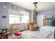 Bright bedroom with a loom, large window, and decorative masks at 25 E 40Th St # Apt 1B/D, Indianapolis, IN 46205
