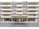 Inviting building entrance with a modern canopy, potted plants, and bench seating at 25 E 40Th St # Apt 1B/D, Indianapolis, IN 46205