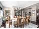 Bright dining room showcasing dark wood floors, elegant decor, and a stylish display cabinet at 25 E 40Th St # Apt 1B/D, Indianapolis, IN 46205