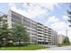Spacious brick apartment building with balconies, well-maintained lawn, and mature trees at 25 E 40Th St # Apt 1B/D, Indianapolis, IN 46205