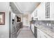 Bright kitchen features stainless steel appliances, granite countertops, and modern cabinetry at 25 E 40Th St # Apt 1B/D, Indianapolis, IN 46205