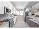 Updated kitchen features granite countertops, stainless steel appliances, and ample cabinetry at 25 E 40Th St # Apt 1B/D, Indianapolis, IN 46205