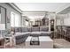 Spacious living room with large sectional sofa, hardwood floors, and open floor plan at 25 E 40Th St # Apt 1B/D, Indianapolis, IN 46205