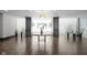 Elegant lobby with a round table, plants, and glass brick walls at 25 E 40Th St # Apt 1B/D, Indianapolis, IN 46205