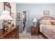 Bedroom featuring a large bed, a dark wood dresser, and a glimpse into the closet at 25 E 40Th St # Apt 1B/D, Indianapolis, IN 46205