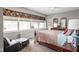 Inviting main bedroom with a comfortable bed, floral valances, and ample natural light at 25 E 40Th St # Apt 1B/D, Indianapolis, IN 46205