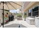 Outdoor patio area featuring a grill, plants, and storage space at 25 E 40Th St # Apt 1B/D, Indianapolis, IN 46205