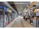 Long storage room with chain-link cages and overhead pipes at 25 E 40Th St # Apt 1B/D, Indianapolis, IN 46205