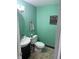 Cozy half-bathroom features a modern sink, toilet and decorative wall hangings at 2615 Alexandria Pike, Anderson, IN 46012