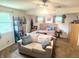 Spacious bedroom with a seating area and plenty of natural light from multiple windows at 2615 Alexandria Pike, Anderson, IN 46012