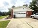 Spacious detached garage with white door and brick facade with room for car and storage at 2615 Alexandria Pike, Anderson, IN 46012