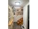 Hallway with stairwell leading to dining room and kitchen with hardwood steps at 2615 Alexandria Pike, Anderson, IN 46012
