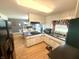 Bright kitchen featuring dark counters, stainless sink, hardwood floors and connection to dining area at 2615 Alexandria Pike, Anderson, IN 46012