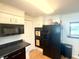 Functional kitchen offering plenty of cabinet space, modern appliances, and good lighting at 2615 Alexandria Pike, Anderson, IN 46012