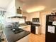 Well-maintained kitchen featuring black appliances, plenty of counter space and classic white cabinets at 2615 Alexandria Pike, Anderson, IN 46012