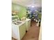 Practical laundry room equipped with washer, dryer, and shelving for storage at 2615 Alexandria Pike, Anderson, IN 46012
