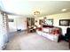 Spacious living room featuring plush carpeting, comfortable seating, and plenty of natural light at 2615 Alexandria Pike, Anderson, IN 46012