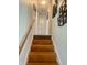Carpeted stairway with decorative wall art to upper level at 2615 Alexandria Pike, Anderson, IN 46012