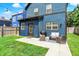 Charming backyard featuring a patio with outdoor seating, a grill, and a lush lawn perfect for entertaining at 2720 Guilford Ave, Indianapolis, IN 46205