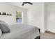 Cozy bedroom with neutral walls, a double closet, and natural light from the window at 2720 Guilford Ave, Indianapolis, IN 46205