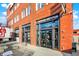 Building entrance of a commercial building with brick architecture and prominent signage and glass door front at 2720 Guilford Ave, Indianapolis, IN 46205