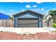 Detached garage with a modern design, a gray door, and ample space for parking and storage at 2720 Guilford Ave, Indianapolis, IN 46205