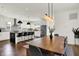 Open-concept kitchen featuring stainless steel appliances, a center island, and stylish lighting, perfect for cooking and gathering at 2720 Guilford Ave, Indianapolis, IN 46205