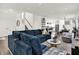 Spacious living room with modern furnishings, neutral walls, and plenty of natural light, creating an inviting space at 2720 Guilford Ave, Indianapolis, IN 46205
