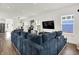 Inviting living room area that flows into the dining area offering an open concept layout with natural lighting at 2720 Guilford Ave, Indianapolis, IN 46205