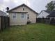 Large backyard with a well-maintained lawn and privacy fence, offering ample space for outdoor activities and relaxation at 2824 Brown St, Anderson, IN 46016