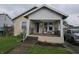 Charming bungalow featuring a cozy front porch, inviting curb appeal, and well-maintained landscaping at 2824 Brown St, Anderson, IN 46016