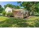 Rear exterior of a home featuring a deck, siding, and backyard at 2906 E 65Th St, Indianapolis, IN 46220