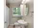 Bathroom with tile floors, pedestal sink, and nice natural light at 2906 E 65Th St, Indianapolis, IN 46220