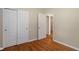 A bedroom with a closet, wood floors, neutral paint, and good natural light at 2906 E 65Th St, Indianapolis, IN 46220