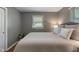 A bedroom with a large bed, natural light, and neutral tones at 2906 E 65Th St, Indianapolis, IN 46220