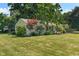 Beautifully landscaped yard complements the home's exterior at 2906 E 65Th St, Indianapolis, IN 46220