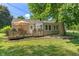 Back exterior of a home featuring a deck, siding, and backyard at 2906 E 65Th St, Indianapolis, IN 46220