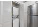This in-unit laundry closet features a stacked washer and dryer, perfect for convenient and efficient laundry days at 2906 E 65Th St, Indianapolis, IN 46220