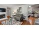 Cozy living room featuring hardwood floors and a fireplace at 2906 E 65Th St, Indianapolis, IN 46220