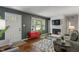 Sunlit living room boasts hardwood floors and a stylish fireplace at 2906 E 65Th St, Indianapolis, IN 46220