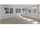 Bright sunroom with multiple windows offering great views, tiled floor and white trim at 2906 E 65Th St, Indianapolis, IN 46220