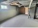 Bright unfinished basement with painted walls, concrete floor, and utility access at 3015 Mckinley Ave, Columbus, IN 47201