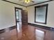 Bedroom with hardwood floors, natural light, and dark wood trim at 3015 Mckinley Ave, Columbus, IN 47201