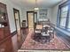 Formal dining room featuring a large rug, ample seating, and natural light at 3015 Mckinley Ave, Columbus, IN 47201