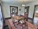 Elegant dining room with a large table, hardwood floors, and vintage charm at 3015 Mckinley Ave, Columbus, IN 47201