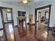 Elegant living room featuring a fireplace, hardwood floors, and detailed trim at 3015 Mckinley Ave, Columbus, IN 47201
