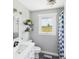 Fresh bathroom featuring white countertops, fixtures, shelving and a sunny window with a view at 4511 W 300 S, Anderson, IN 46011