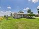Beautiful ranch home featuring lovely landscaping, a brick exterior, and a serene country setting at 4511 W 300 S, Anderson, IN 46011