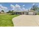 Charming ranch-style home with a large yard, brick exterior, and attached two-car garage at 4511 W 300 S, Anderson, IN 46011